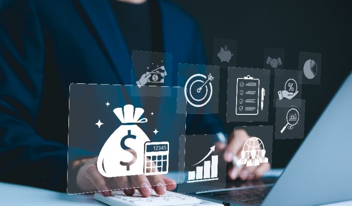 A person in a suit works on a laptop, with transparent financial icons overlaid—including a money bag and chart—highlighting how benchmarking insights can turn data to dollars for higher profits.
