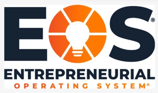 Logo for EOS Entrepreneurial Operating System, featuring large EOS text with an orange light bulb in the center of the O, and smaller text below reading Entrepreneurial Operating System—a perfect fit for those looking to Run Your Business with EOS Implementation.