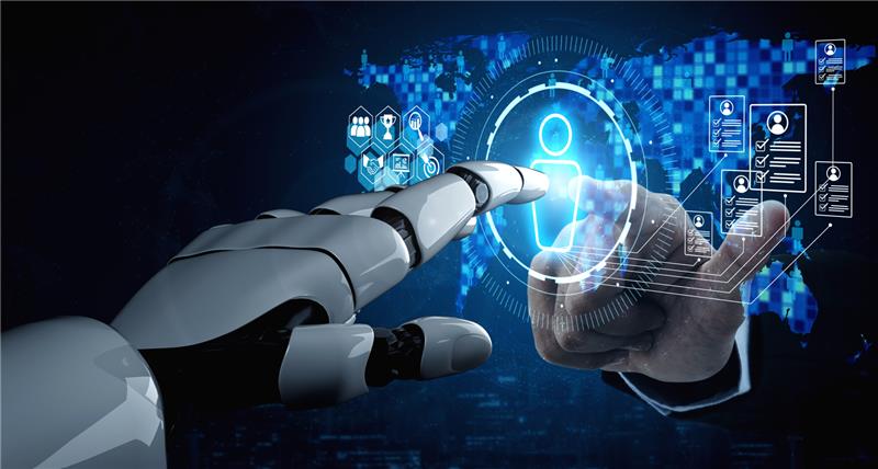 Evolving, Not Extinct: How AI Is Reshaping the Recruiter’s Role in IT Staffing  1 A robotic hand and a human hand reach toward a glowing digital interface with icons representing people and technology, set against a world map background, symbolizing the recruiter’s role in advancing human-AI collaboration in IT staffing.