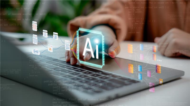 A person uses a laptop with digital graphics showing an AI icon and interconnected data nodes, symbolizing staffing automation and artificial intelligence in data processing for staffing firms.