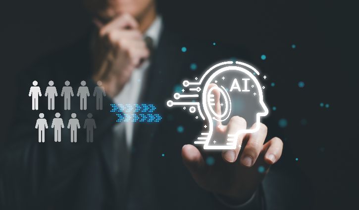 A person in a suit touches a virtual screen displaying a glowing AI head icon, with illustrated people figures and digital elements suggesting artificial intelligence and technology concepts.