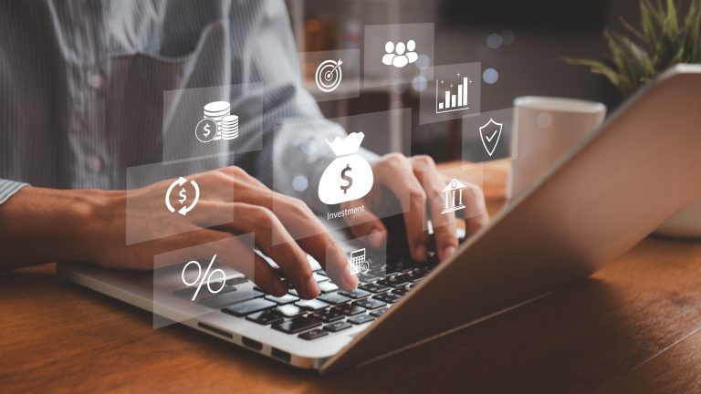 Person typing on a laptop with floating finance-related icons, such as investment, chart, percentage, shield, and money symbols, representing digital financial management or online banking.